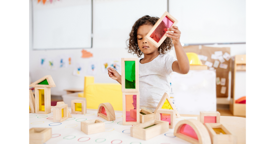 kids playing with wooden blocks 
