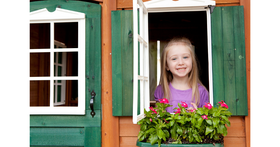 little girl playing in a pretend play house at little explorers adventure park 