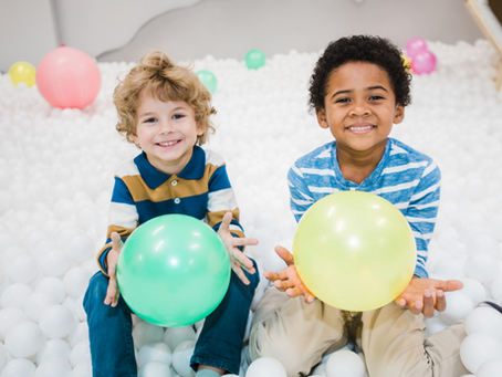 kids birthday party with balloons at little explorers