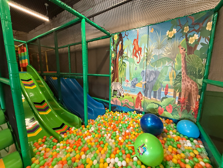 colorful ball pit and slide at little explorers