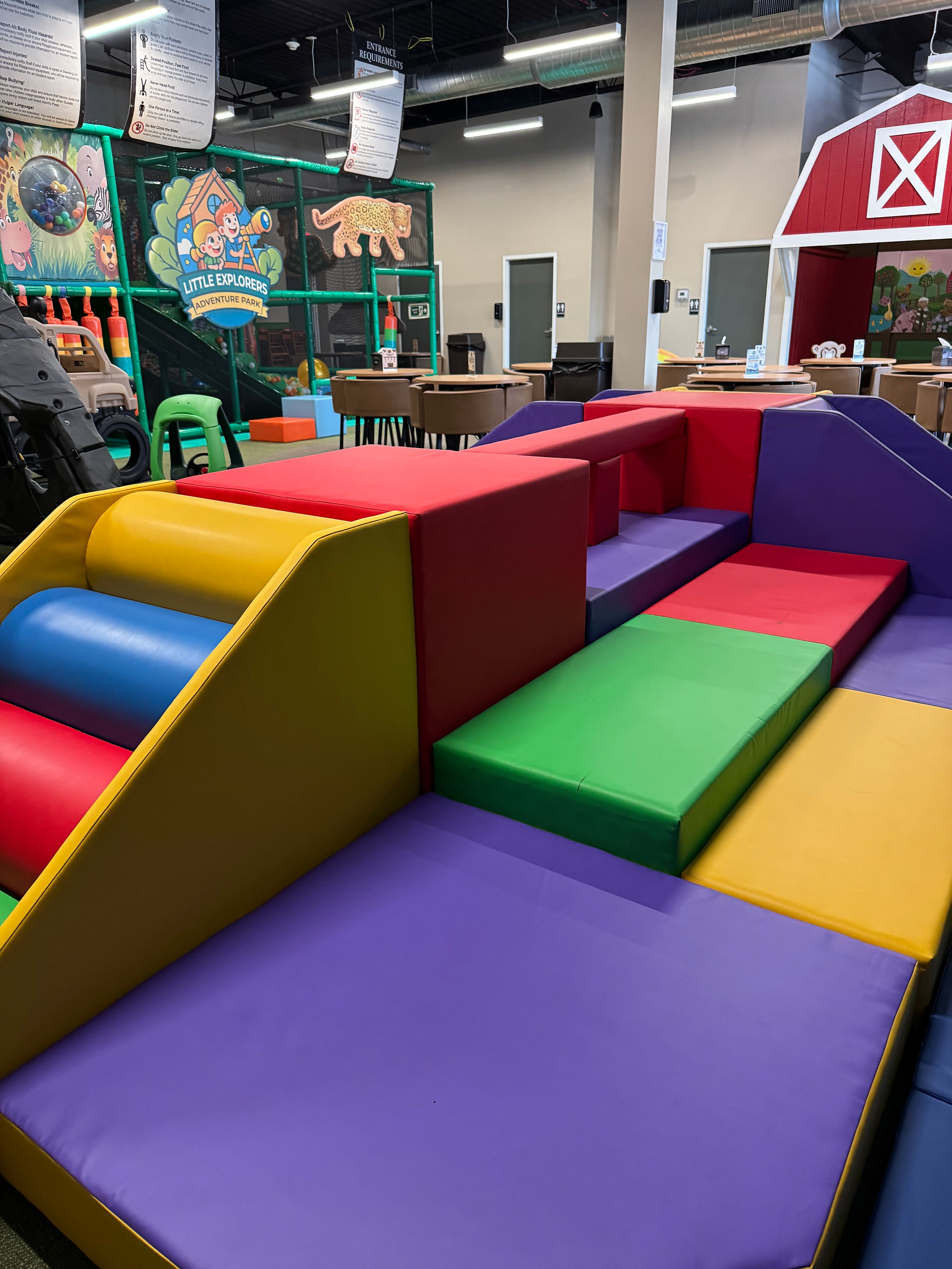 colorful soft play area at little explorers